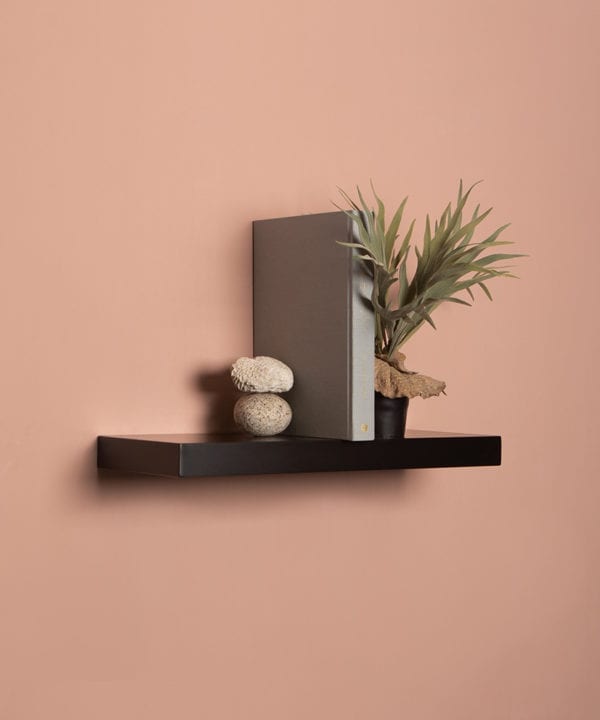 medium black floating shelf on pink background