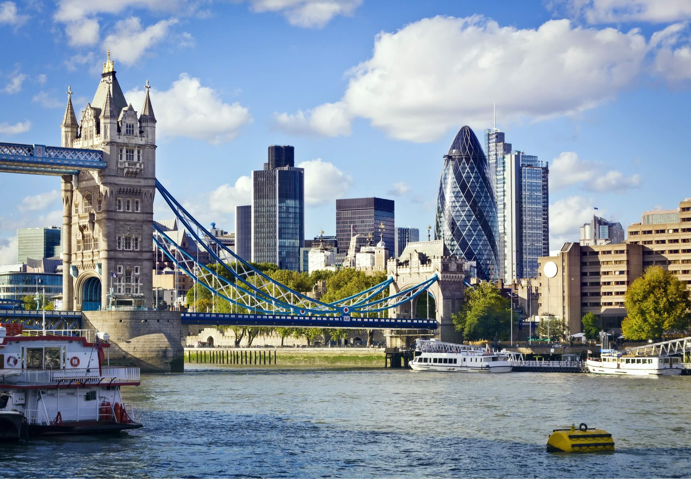 photo of the thames in london with the shard in the background