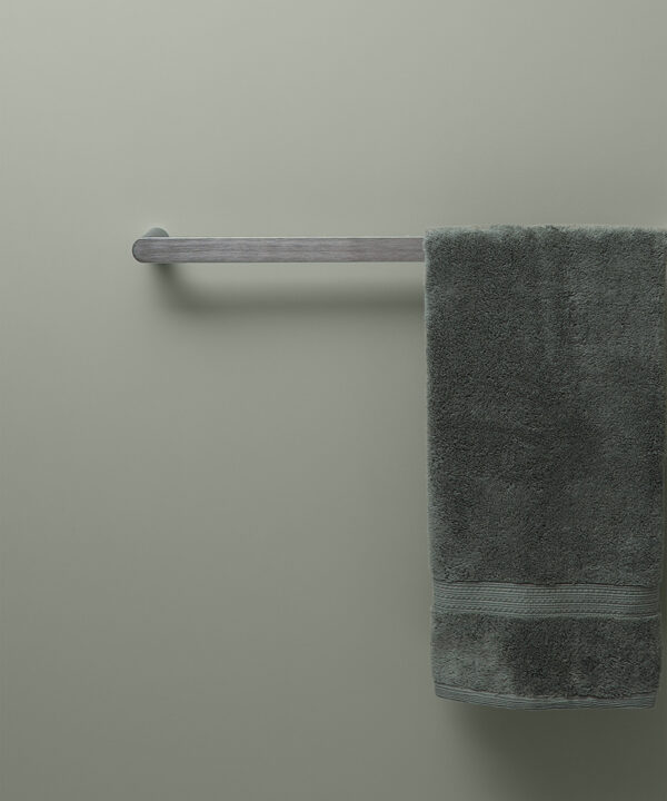 silver guest towel rail on grey background