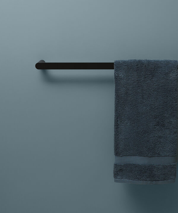 black guest towel rail on blue background