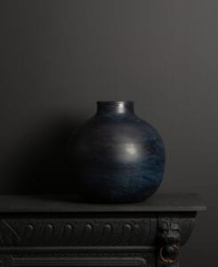 large blue grey vase on dark background