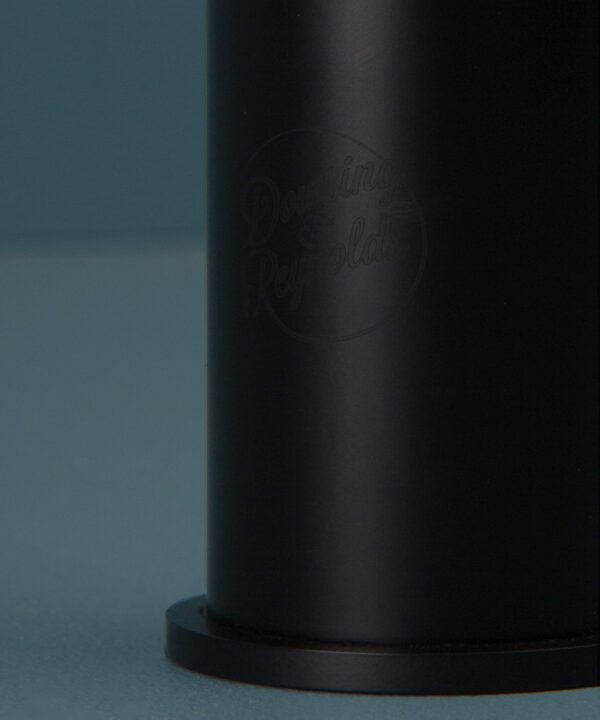 black inga tap close up of logo on blue background