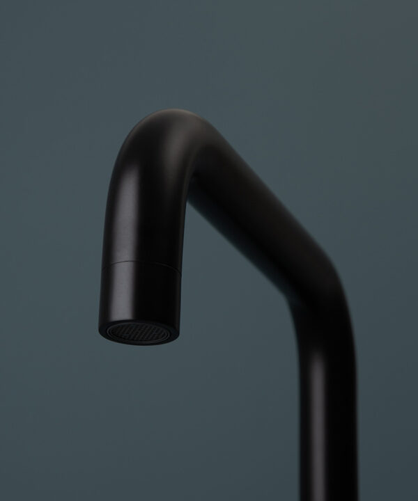 black kintampo tap close up of spout on blue background