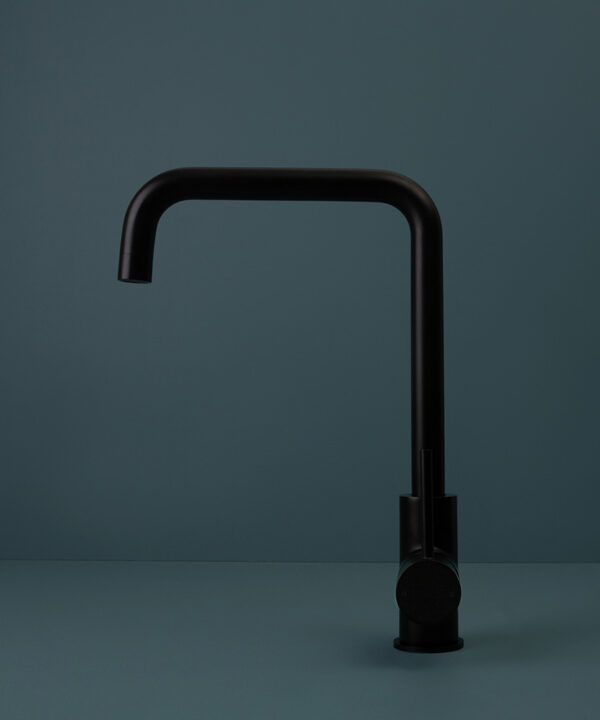 black kintampo tap side angle on blue background