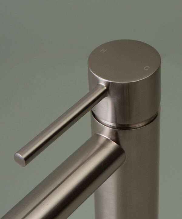 silver inga tap close up of handle on grey-green background