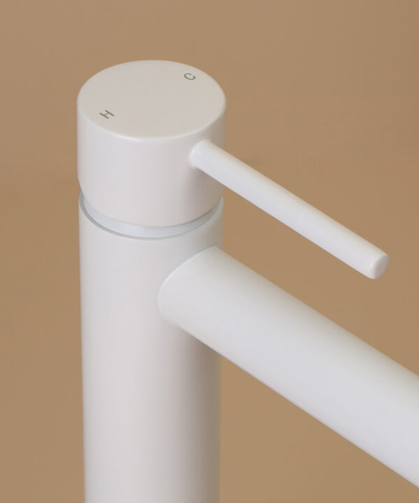 white kagera tap close up of handle hot and cold