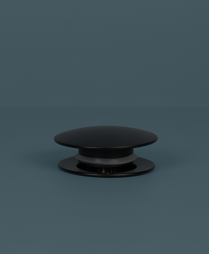 black unslotted click clack waste up on blue background