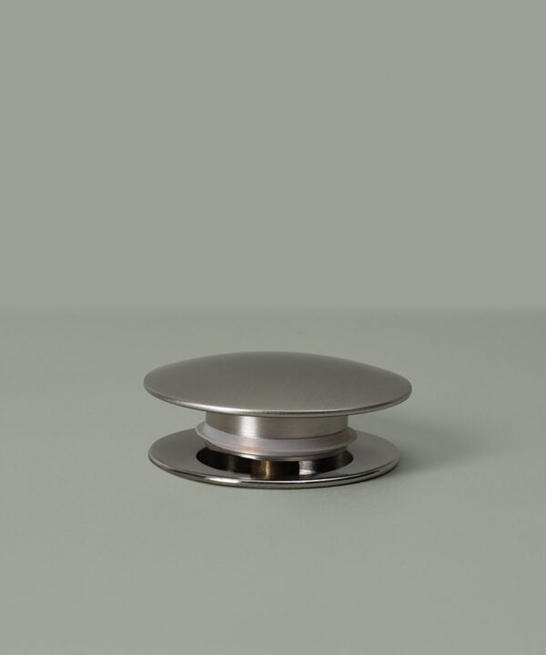 silver unslotted click clack waste on grey background