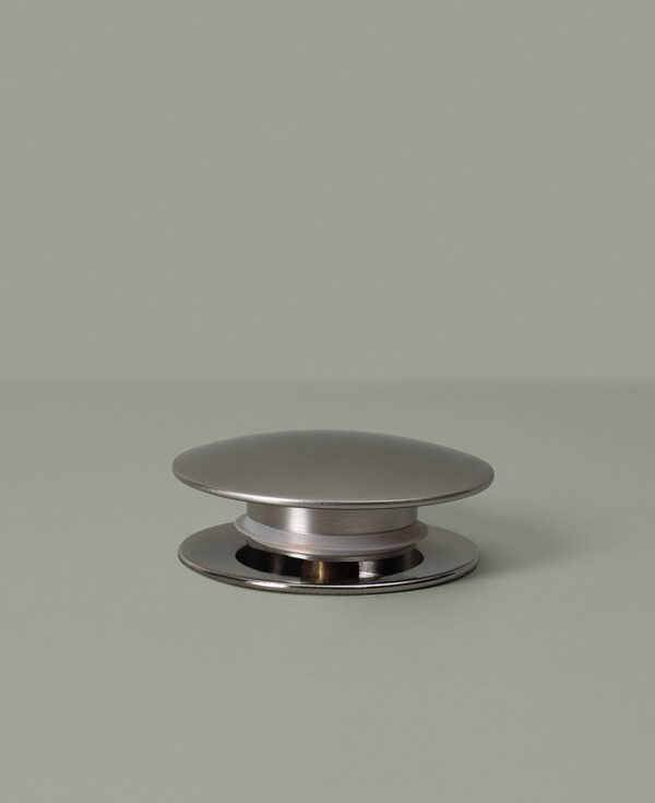 silver unslotted click clack waste on grey background