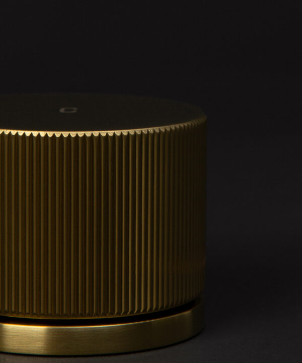 gold reeded tap close up of handle on black background
