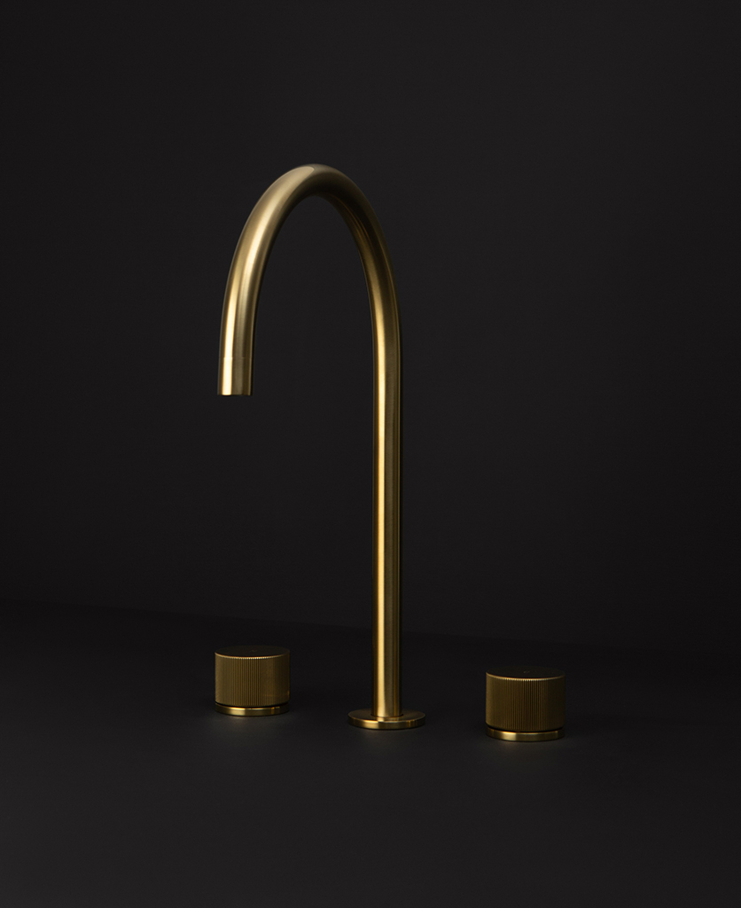 gold reeded tap gold reeded tap close up gold reeded tap close up of spout on black background