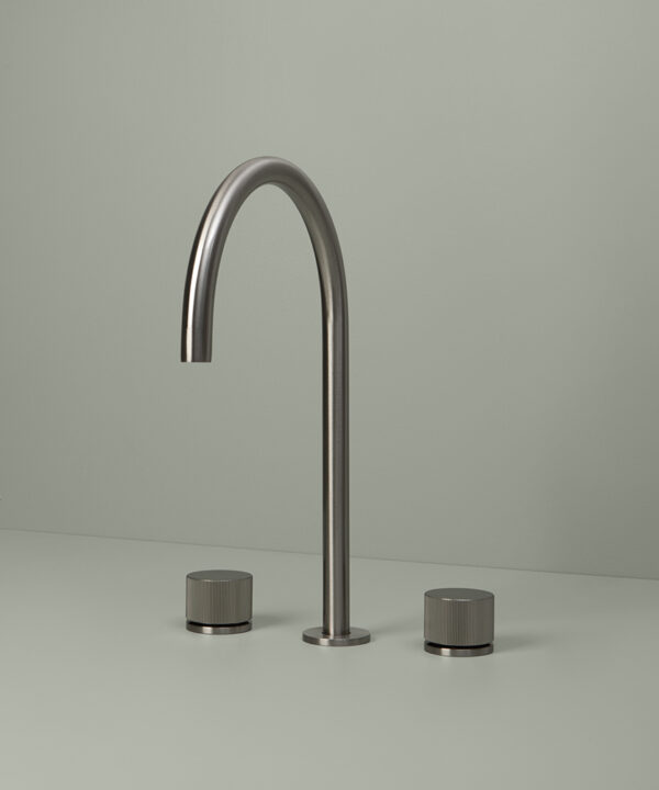 silver reeded tap on grey background