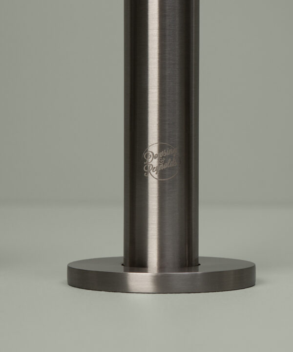 silver reeded tap close up of logo silver reeded tap close up of hot handle on grey background