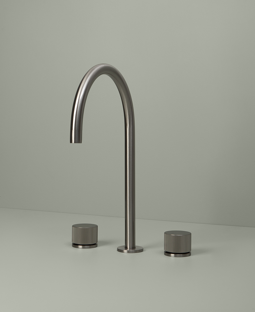 silver reeded tap on grey background