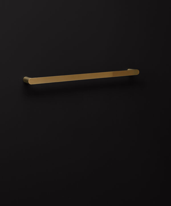 gold towel rail on black background