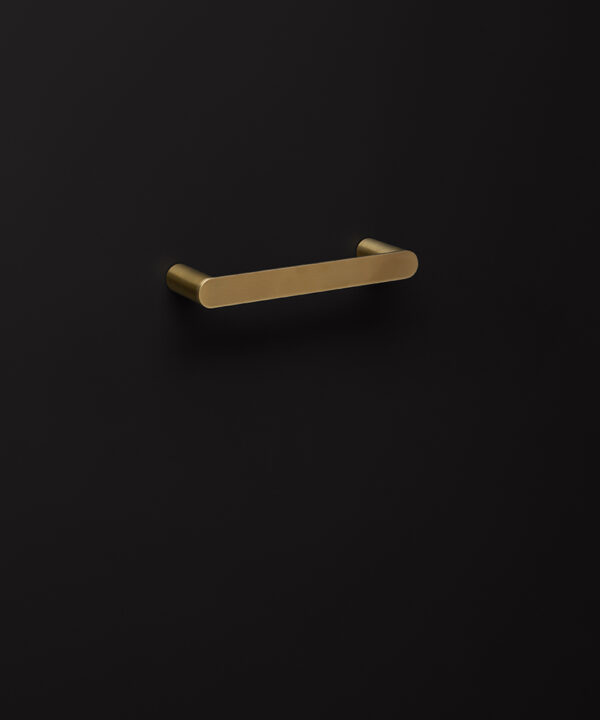 small gold towel rail on black background