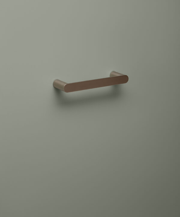 small silver towel rail on grey background