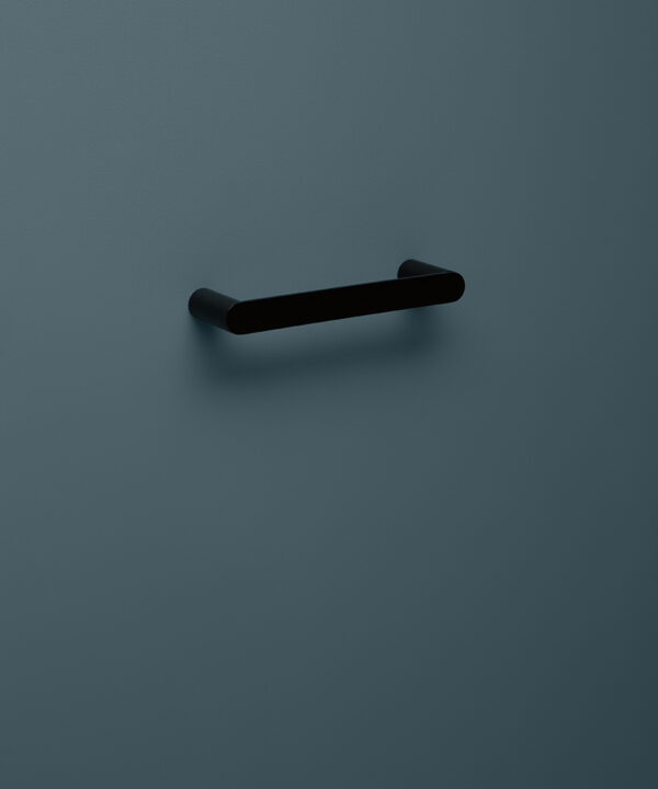 small black towel rail on blue background