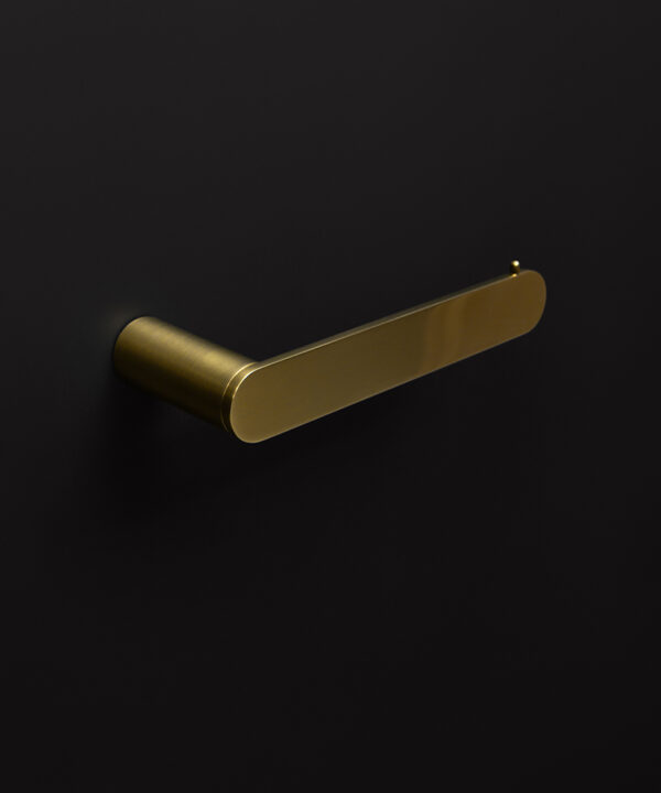 gold paper holder on black background