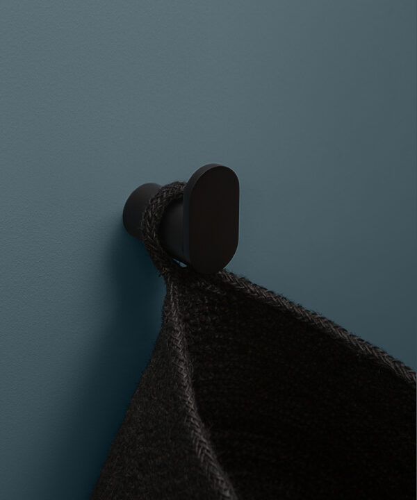 black robe hook on blue background