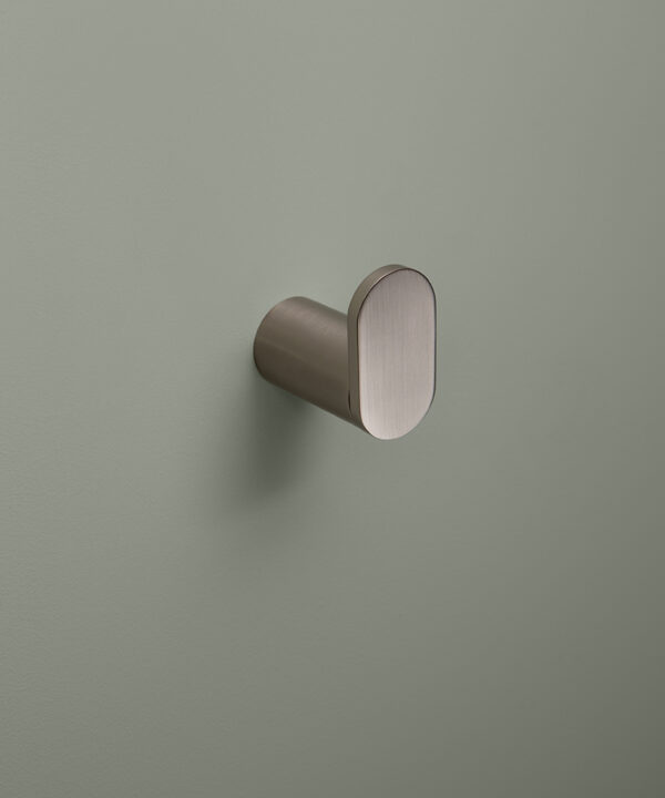 silver robe hook on grey background