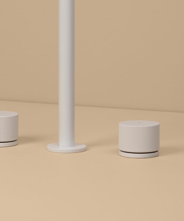 white reeded tap close up 1 on peach background