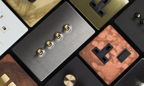 collage of toggle light switches, sockets and dimmers againsdt a black background