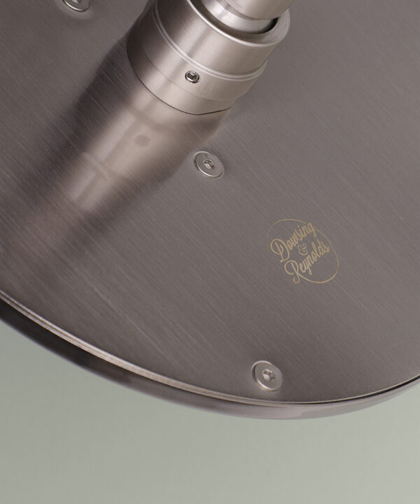 silver shower head close up of logo