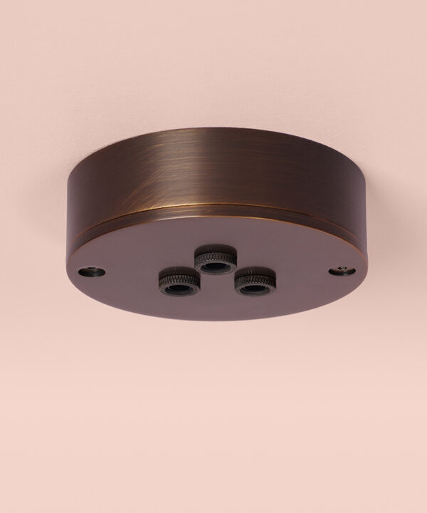 brewers brass 3 point ceiling rose on pink background