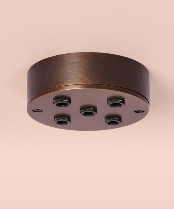 brewers brass 5 point ceiling rose on pink background