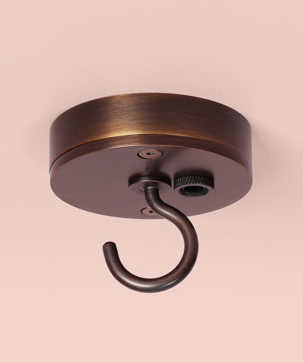 brewer's brass c-hook ceiling rose on pink background