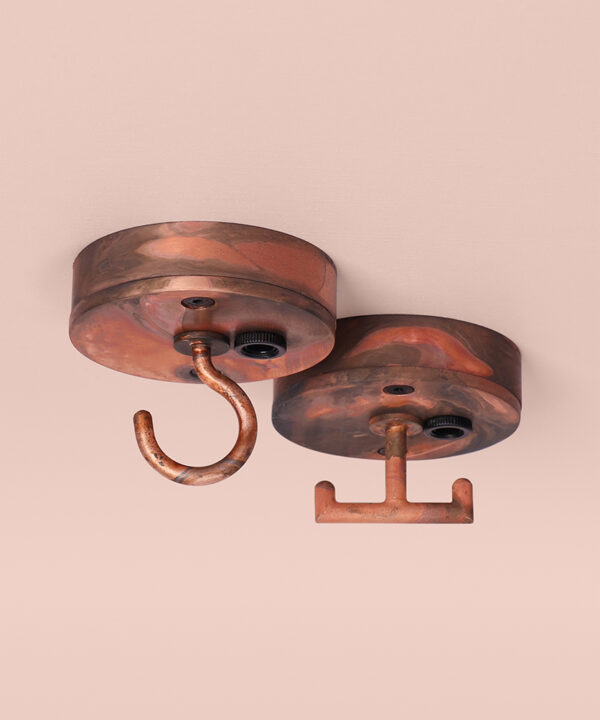 tarnished copper t-hook and c-hook ceiling roses on pink background