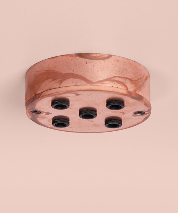 tarnished copper 5 point ceiling rose on pink background