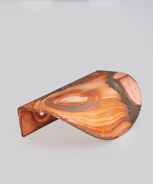 onda tarnished copper pull handle on white background