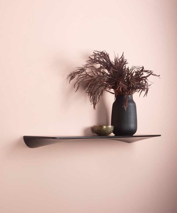 black umage flow shelf on a pink wall