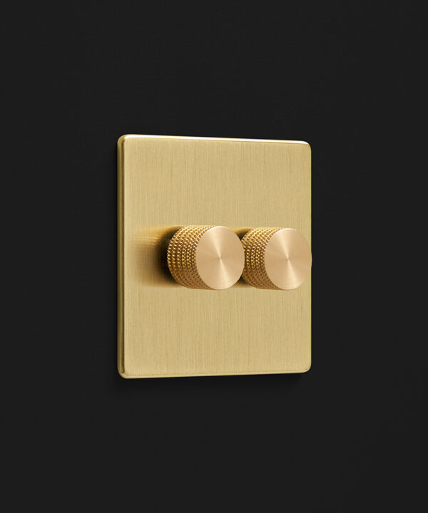 brushed gold double dimmer with knurled brass knobs