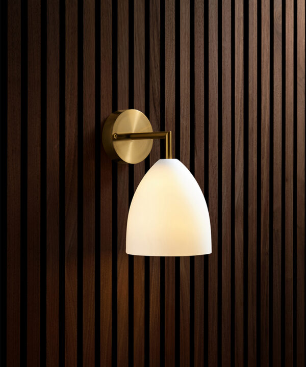 gold metal arm wall light with porcelain shade