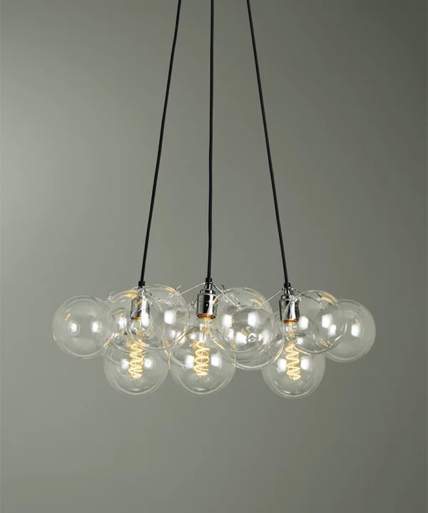 clear medium bubble light chandelier against green background