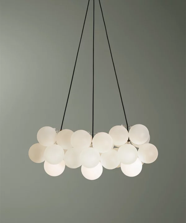 medium frosted bubble glass pendant light with twenty four glass orbs against green background