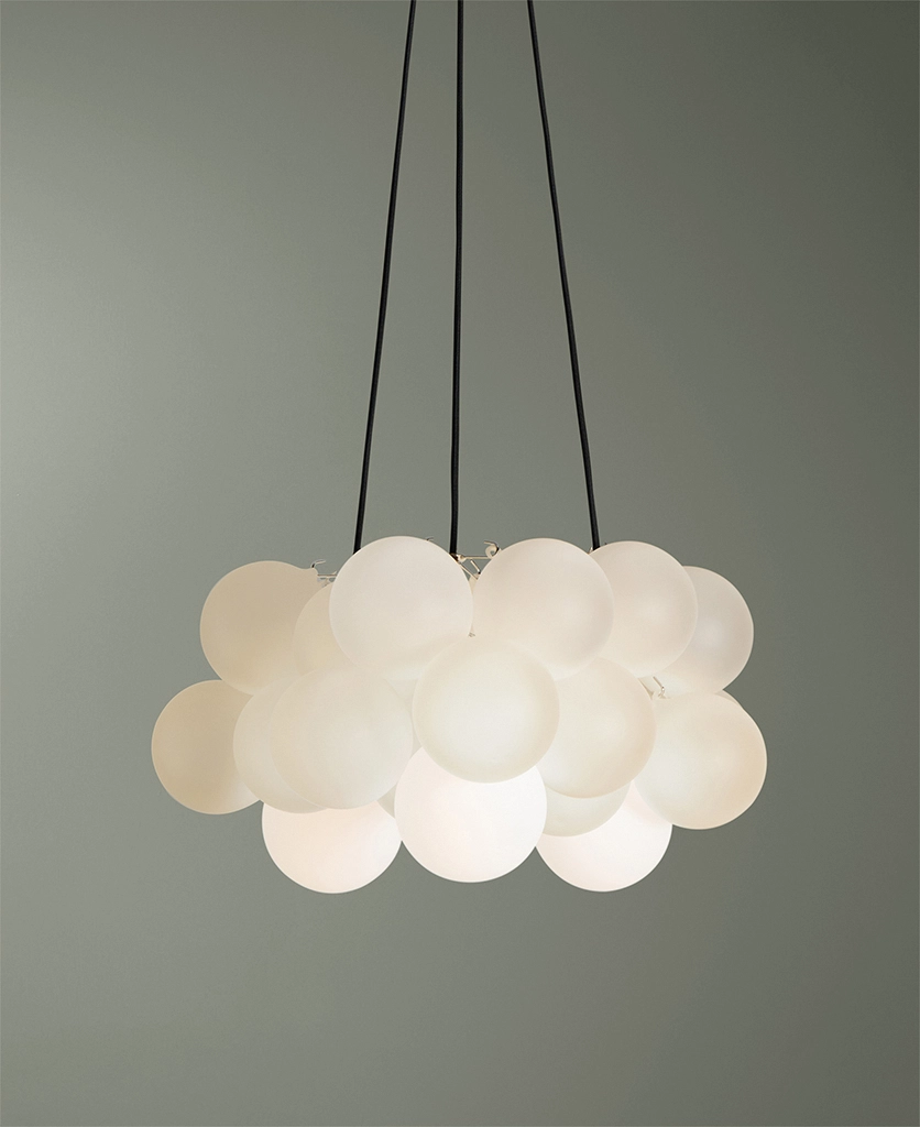 medium frosted bubble glass pendant light with 24 glass orbs against green background