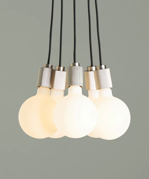 silver meurice dining table light against green background