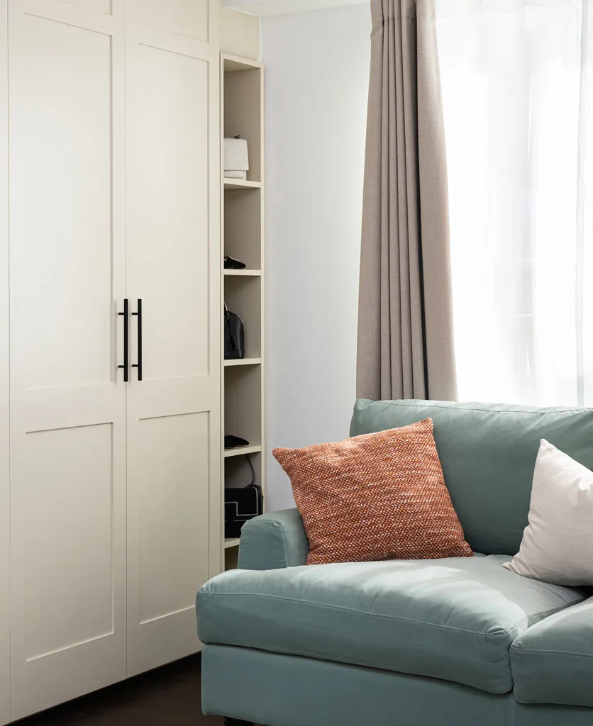 panelling on wardrobe doors painted ivory with smart door handles