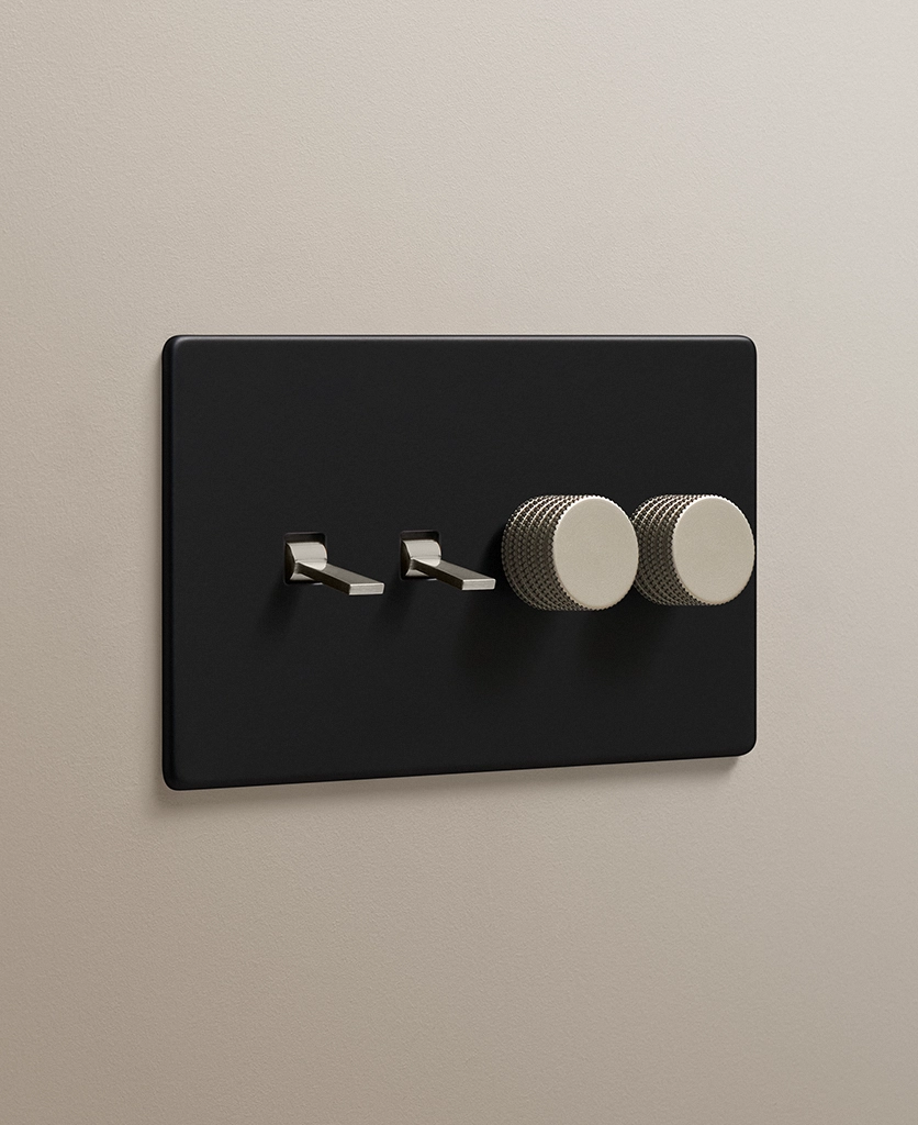 matt black combination light switch with two silver tapered toggles and two silver knurled dimmer knobs