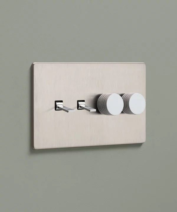 brushed silver four gang quadruple combination light switch with two tapered toggles and two knurled dimmer knobs