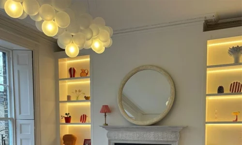 Cloud bubble chandelier in a neutral living room.