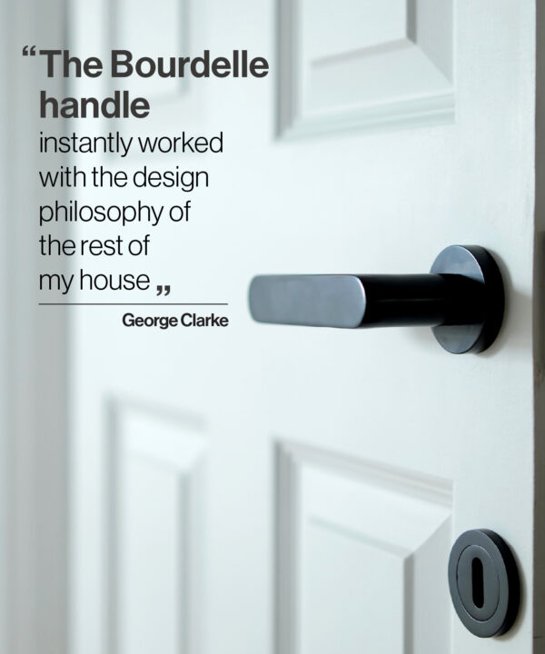 A black Bourdelle door handle on a white door with a quote from TV presenter George Clarke