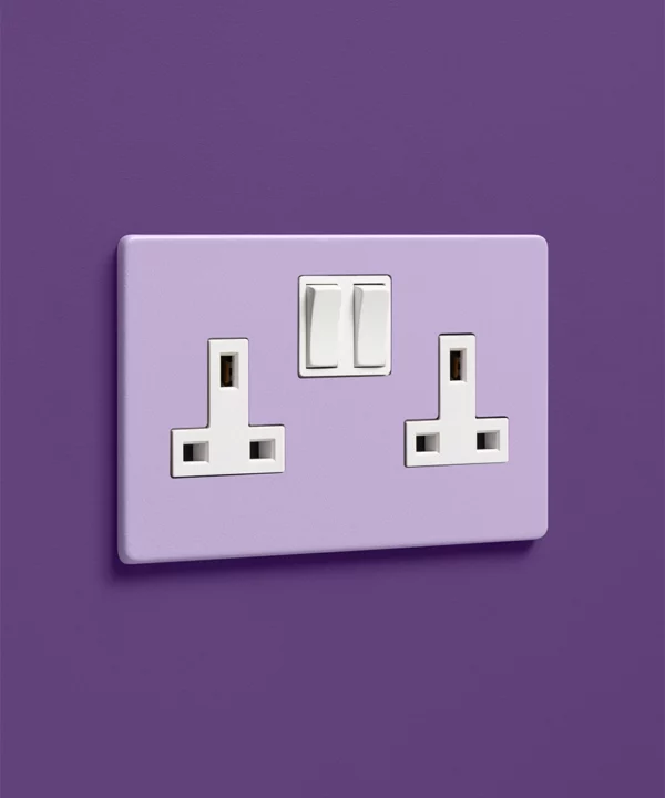 digital lavender lilac purple single 1 gang plug socket on a dark purple wall