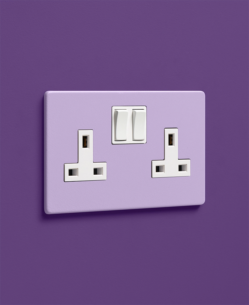 digital lavender lilac purple single 1 gang plug socket on a dark purple wall