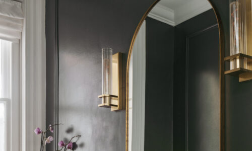 gold fixtures and fittings in an atmospheric bathroom