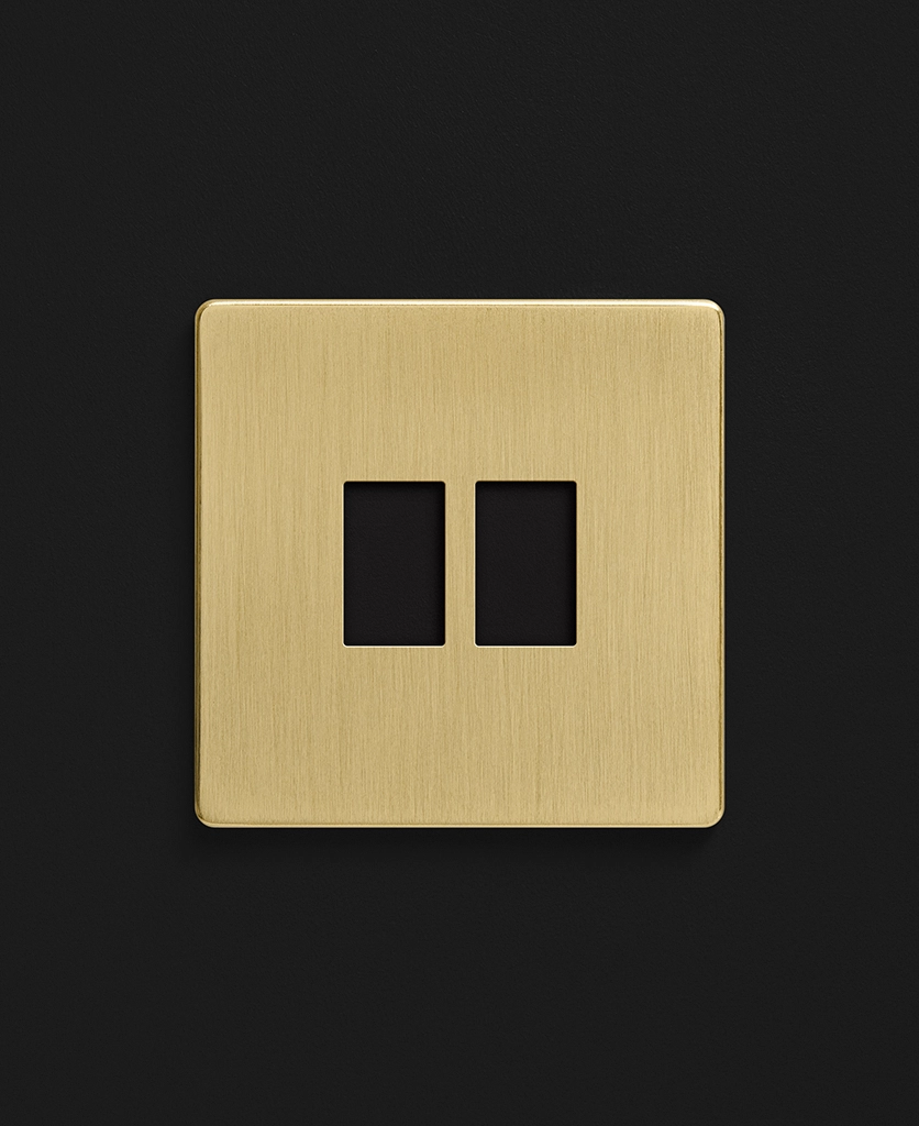 gold double rocker switch with two black switches